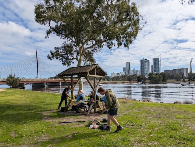 Operators preparing antenna equipment in the park